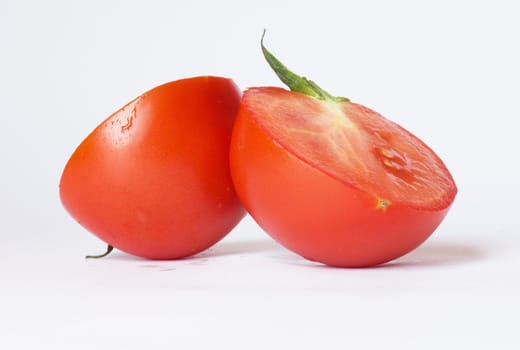 Two tomatoes isolated on white background 