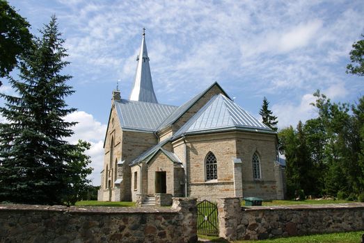 Estonia. Juri.Beautiful operating church on a background of the sky and clouds