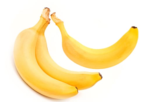 three mature bananas on white background