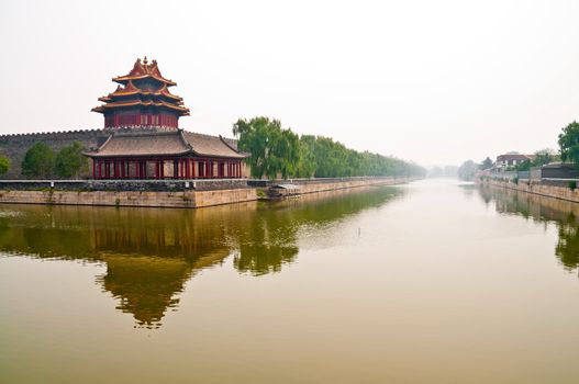 Foggy cCanal outside forbidden city in Beijin, China