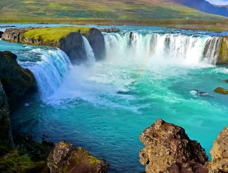 Blue wide river with waterfall in iceland landscape