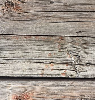 Close up of gray wooden fence panels 