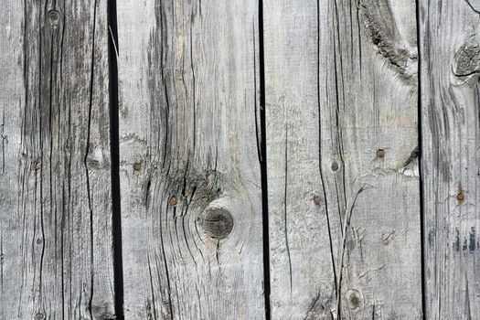 Close up of gray wooden fence panels 