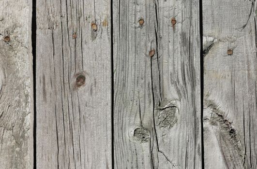 Close up of gray wooden fence panels 