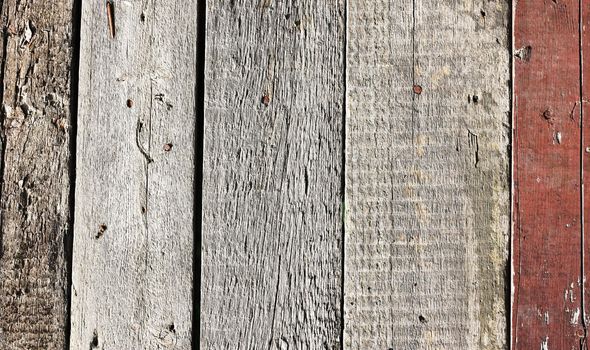 Close up of gray wooden fence panels 