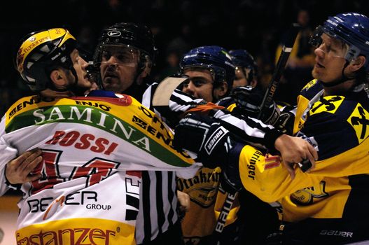ZELL AM SEE, AUSTRIA - FEB 22: Austrian National League. Jari Suorsa and Michael Rossi in a brawl after the game. Game EK Zell am See vs. VEU Feldkirch (Result 3-1) on February 22, 2011 at hockey rink of Zell am See