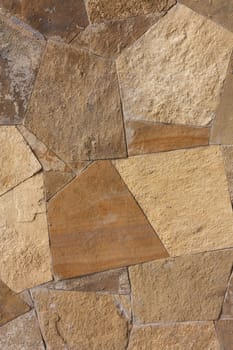 Unshaped stone wall pattern,wall made of rocks 