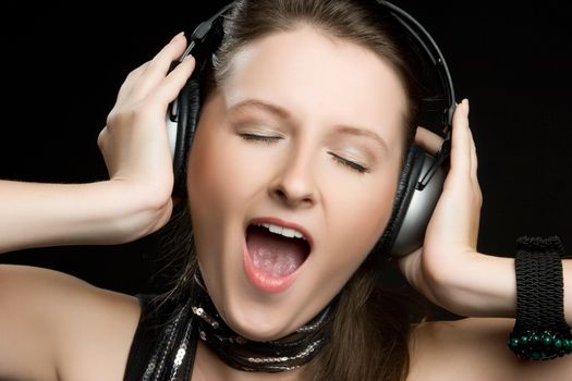 Beautiful singing headphones music woman