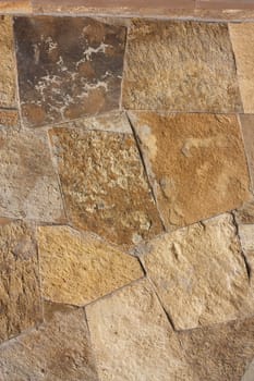 Unshaped stone wall pattern,wall made of rocks 