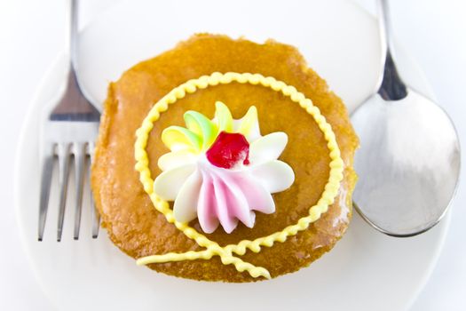 Closeup Cup cake and fork on white background