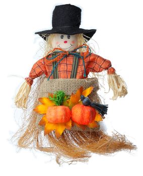 Image of a scarecrow made by straws and clothes photographed in a studio against a white background.