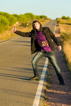 Hitchhiking youngster quite desperate to get a lift