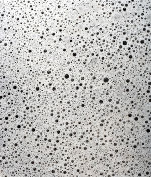 Bubbles of dirty soapy water background.