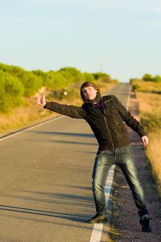 Hitchhiking youngster quite desperate to get a lift