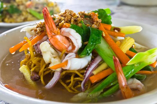 Yellow noodle seafood shrimp and squid
 in Chinese style food