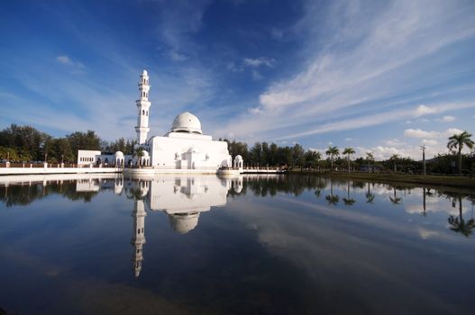 Mosque Tengku Tengah Zaharah or also known as Floating Mosque in Kuala Terengganu, Malaysia with reflection.