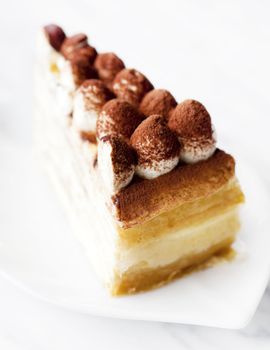 Portion of Tiramisu Mille crepe on a plate