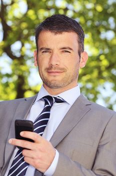 businessman is having a communication with his cellphone