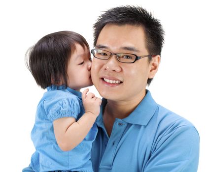 Little girl kissing her father on white background