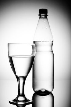 water bottle on a shiny surface in studio