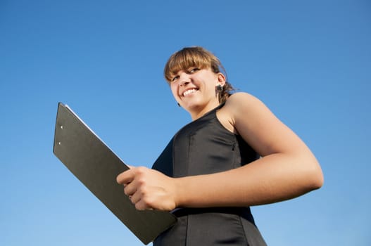 business woman  tablet, background blue sky, see to tablet