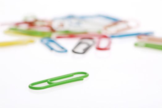 colorful paperclips on white