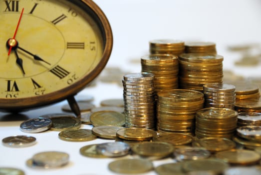 Old hours and different coins - symbol...