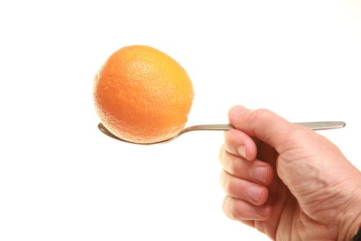 A spoon with a citrus-fruit on it as an symbol for taking vitamins...........