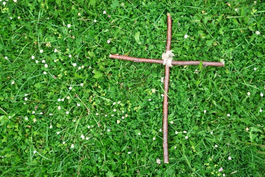 Close-up of a cross on grass