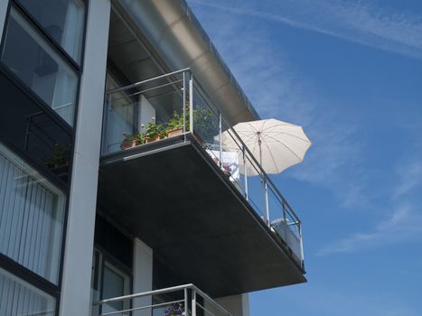 Summer in the city. Sunshade on balcony tto protect for the heat.