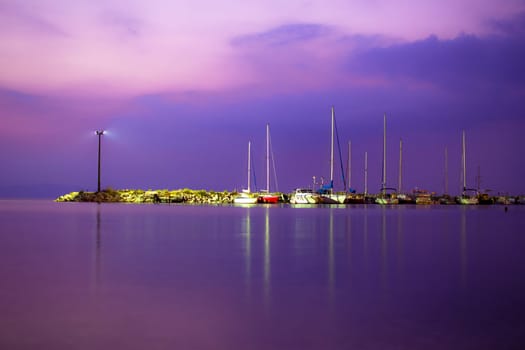 View of a yacht harbor at night. Long exposure shot