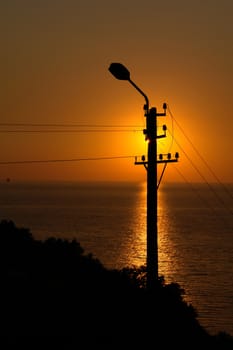 Silhouette of a street lantern on a sunset                              