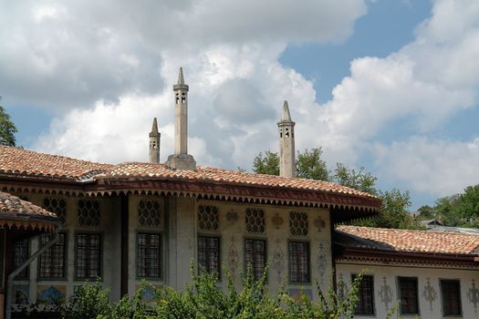 Spikes on a roof of a Muslim building                               