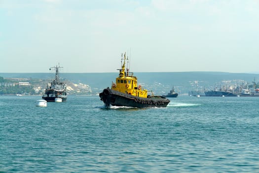 Yellow boat on a background of the blue sea                               