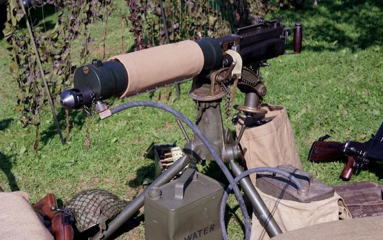 Water cooled machine gun in a mock battle situtation