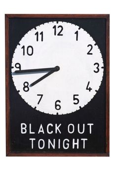 A Second World War sign giving details of the time of the Black Out during which time no light should be shown outside of buildings