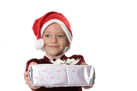The boy in a cap Santa with a gift on a white background