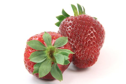 close-up two trawberries isolated on white background fruits and vegetables