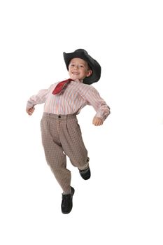 The boy in a tie and a cowboy's hat on a white background