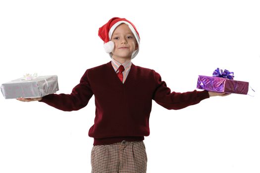  The boy in a sweater and cap Santa holds two gifts