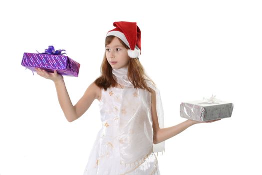 The girl in a white dress and cap Santa holds two gifts