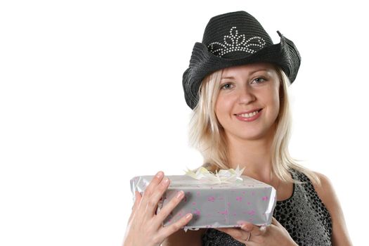 The beautiful young woman in a black hat with a gift