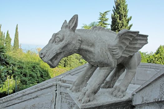 Winged dog on a ladder of an ancient palace in Crimea