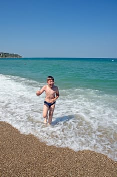 The little boy goes on a beach