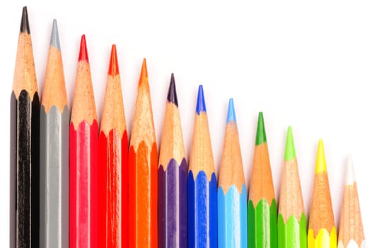 A row of coloured pencils on a white background.