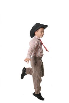 The cheerful boy in a cowboy's hat and a tie