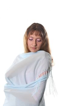 The long-haired girl poses on a white background