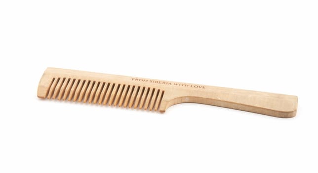 Wooden hairbrush on a white background