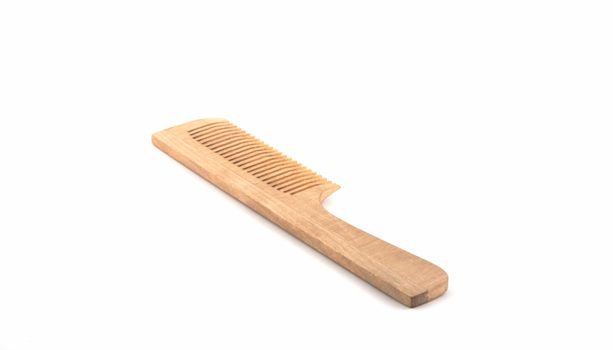 Wooden hairbrush on a white background