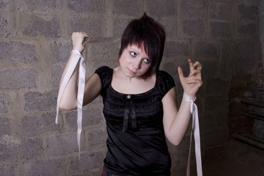 The girl in Gothic style holds the big knife